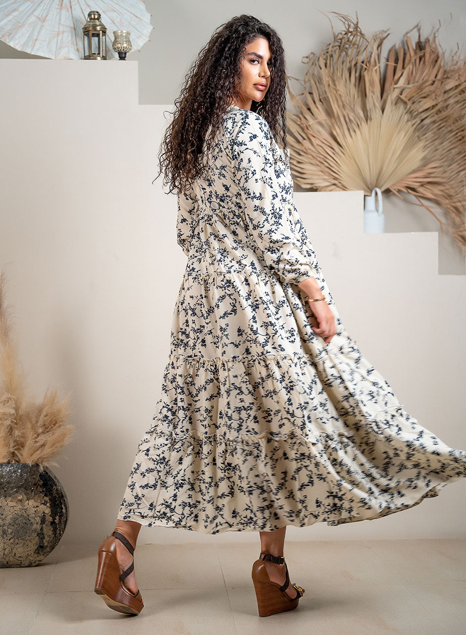 Whispering Petals Tiered Maxi Dress: A Floral Symphony