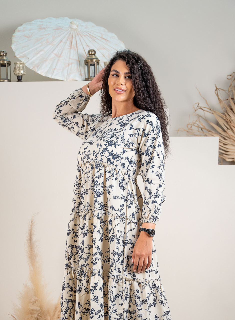Whispering Petals Tiered Maxi Dress: A Floral Symphony