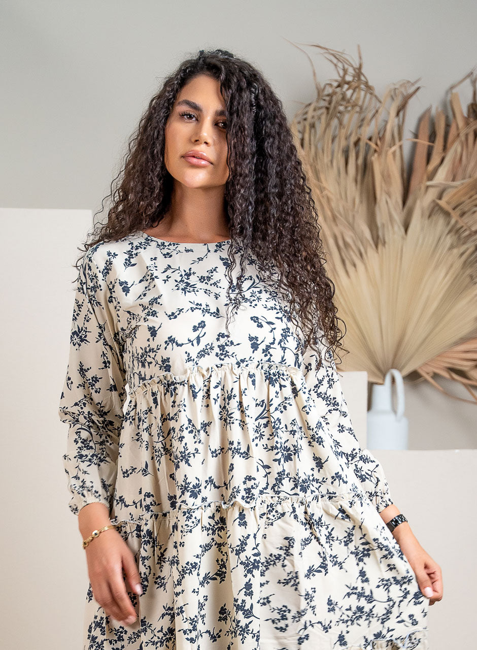 Whispering Petals Tiered Maxi Dress: A Floral Symphony